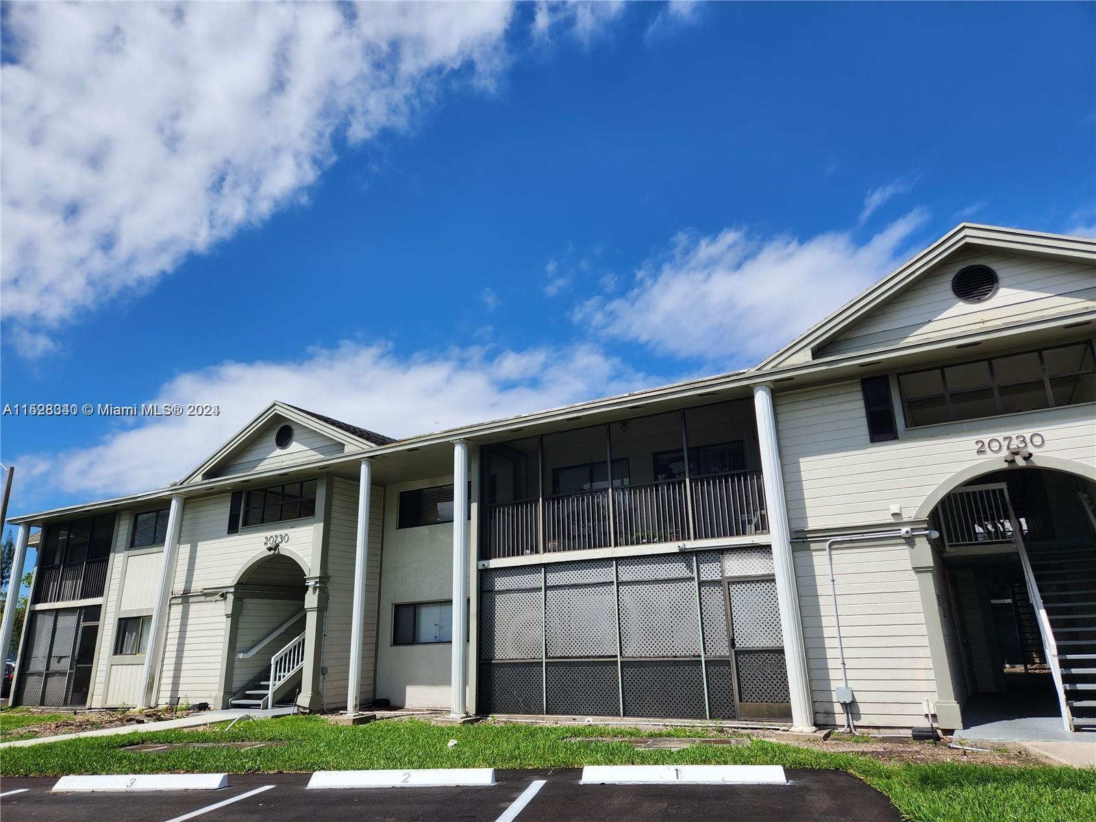 California Club Miami, FL 33179 - Photo 2 of 6 a front view of a house with a yard