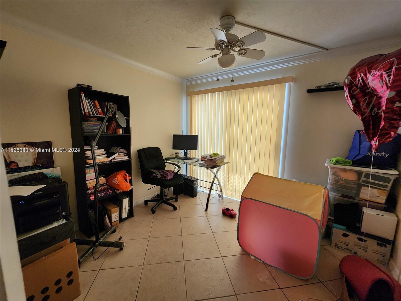 California Club Miami, FL 33179 - Photo 4 of 6 a view of a workspace with furniture and a window