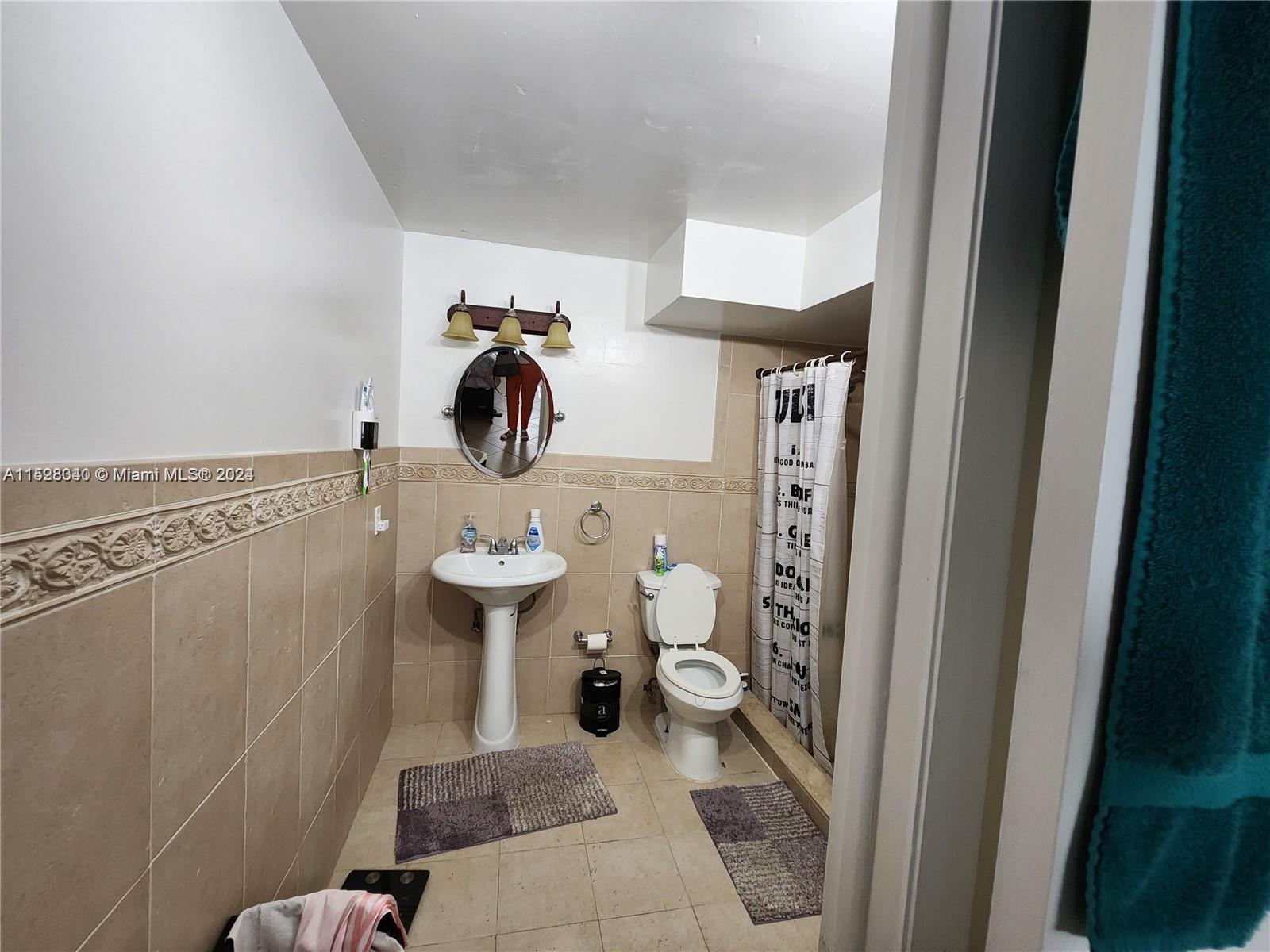 California Club Miami, FL 33179 - Photo 6 of 6 a bathroom with a toilet and a shower