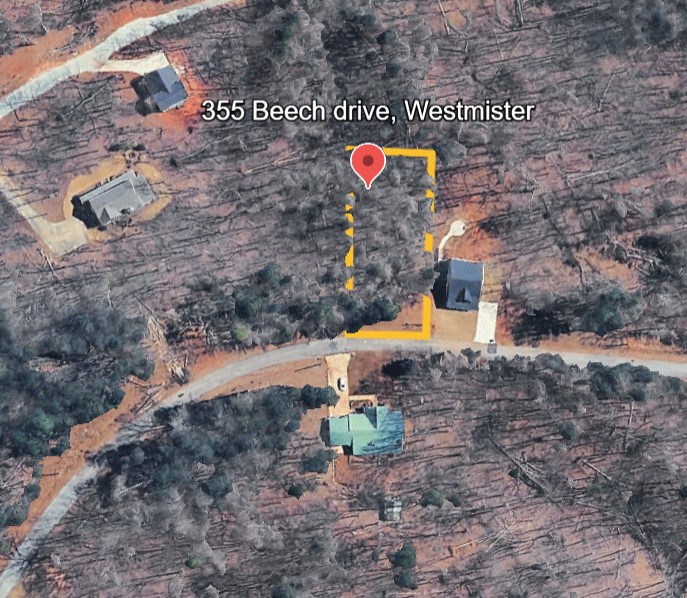 355 Beech Drive Westminster, SC 29693 - Photo 2 of 8 This aerial view showcases a lot nestled amidst a wooded landscape.