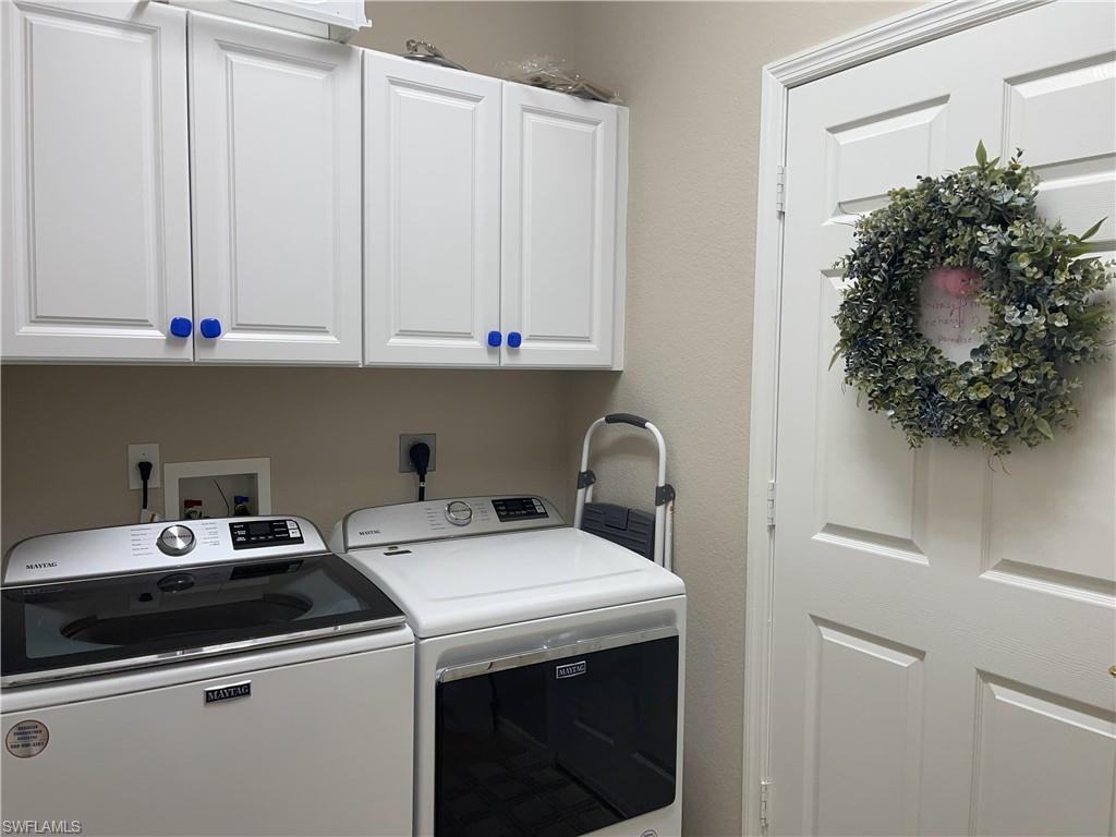 3532 Periwinkle Way, Unit 11 Naples, FL 34114 - Photo 14 of 37 a utility room with dryer and washer