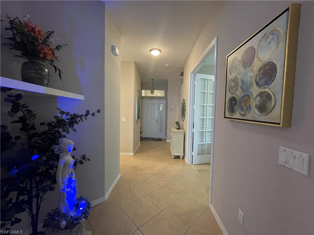 3532 Periwinkle Way, Unit 11 Naples, FL 34114 - Photo 19 of 37 a view of a hallway
