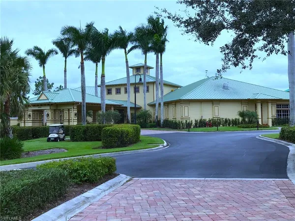 a lobby with furniture and view of living room