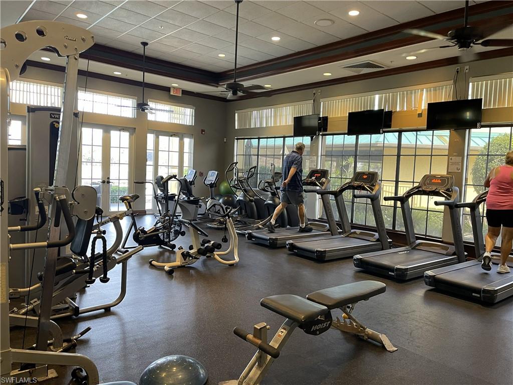 3532 Periwinkle Way, Unit 11 Naples, FL 34114 - Photo 27 of 37 a view of a room with gym equipment