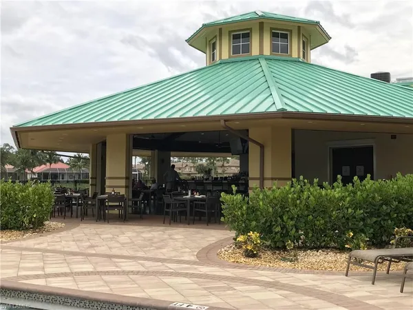 a view of a dining area with furniture and chandelier