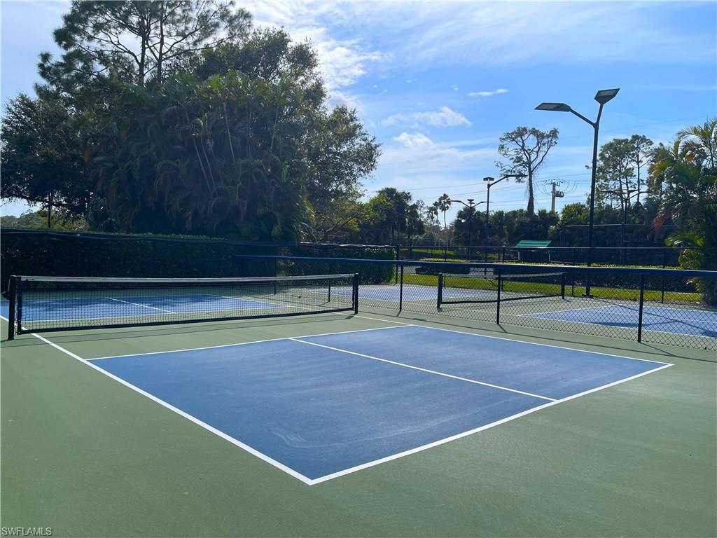 3532 Periwinkle Way, Unit 11 Naples, FL 34114 - Photo 31 of 37 a view of a tennis court