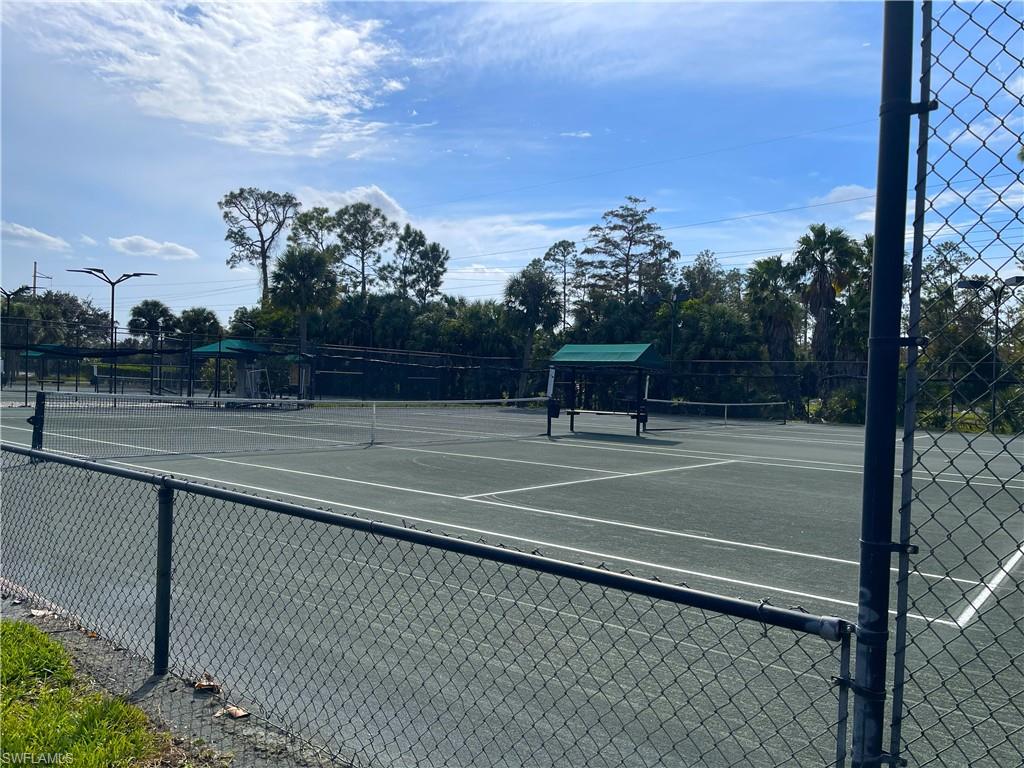 3532 Periwinkle Way, Unit 11 Naples, FL 34114 - Photo 33 of 37 a view of a tennis court