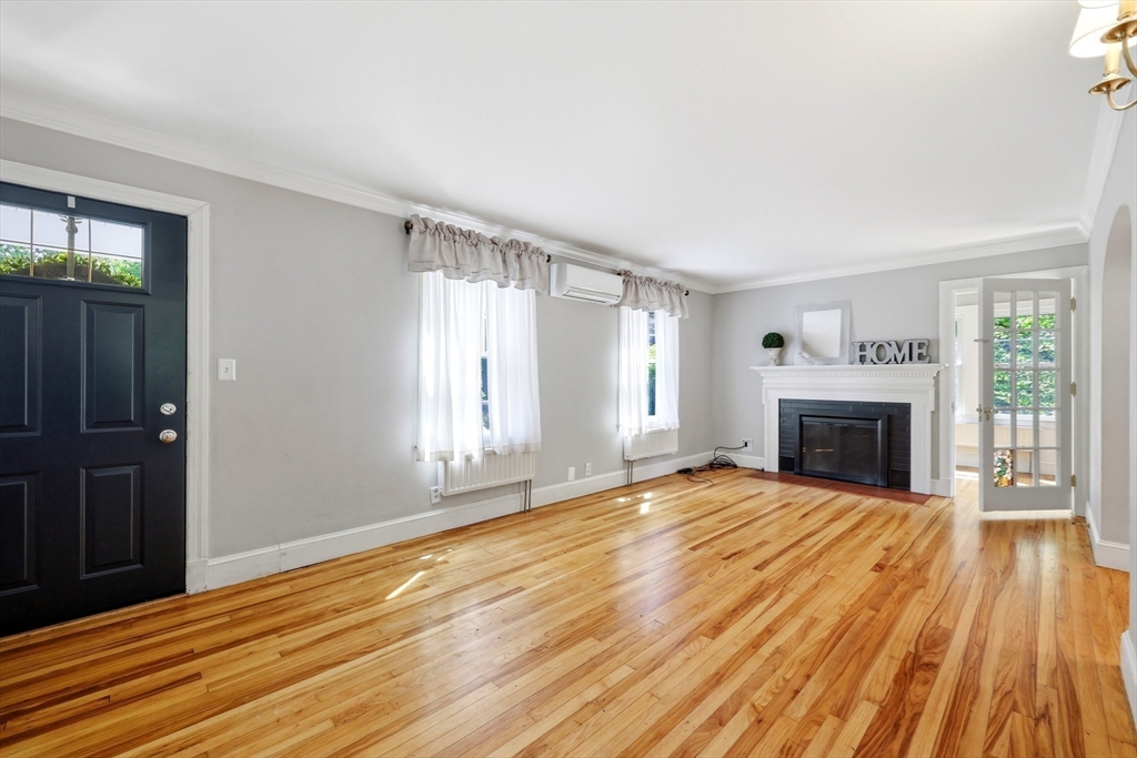 32 Lincoln Road Longmeadow, MA 01106 - Photo 15 of 36 a view of an empty room with wooden floor fireplace and a window