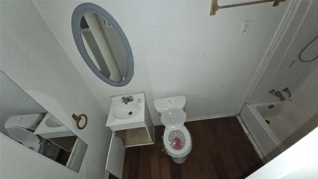 a bathroom with a toilet and a sink