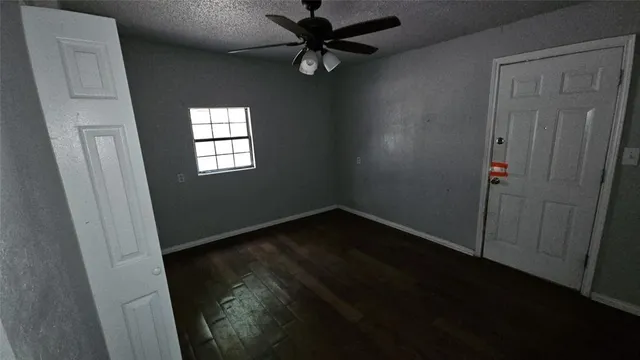 a view of a hallway with windows and stairs