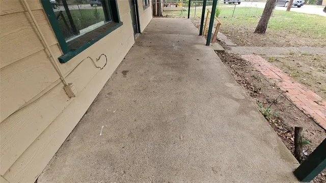 a backyard of a house with a small garden