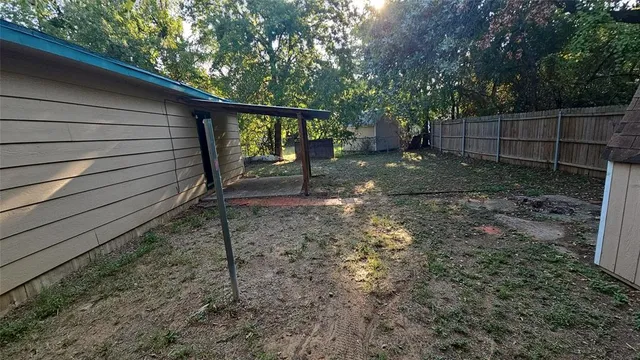 a view of a backyard with a trees