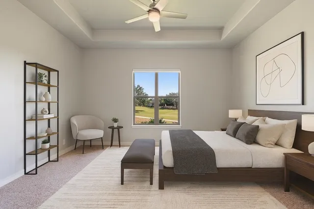 a living room with furniture and a view of kitchen