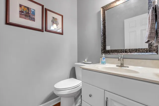 a living room with furniture a flat screen tv and a large window