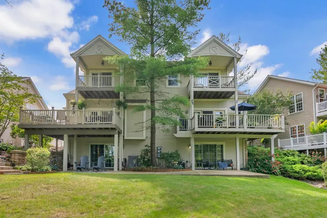 a front view of a building with a garden