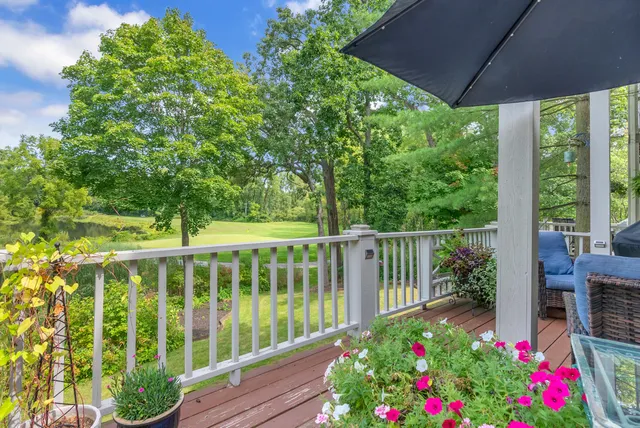 a terrace with outdoor seating and trees