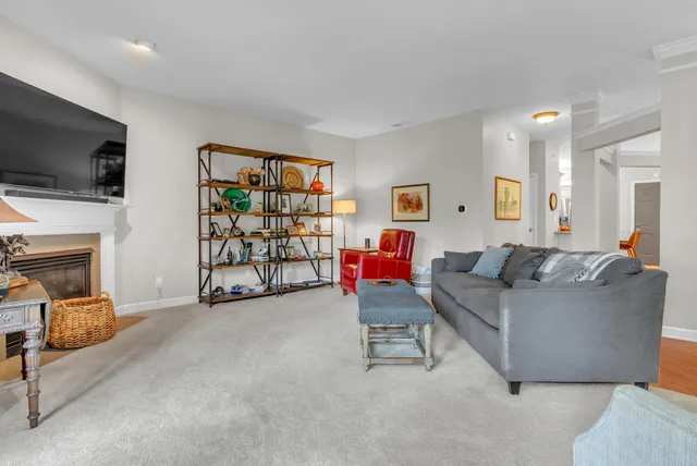 a kitchen with granite countertop white cabinets stainless steel appliances and a sink