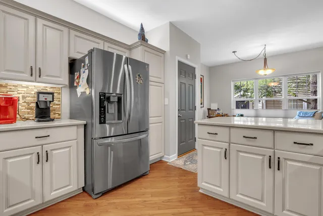 a view of kitchen island with furniture and wooden floor