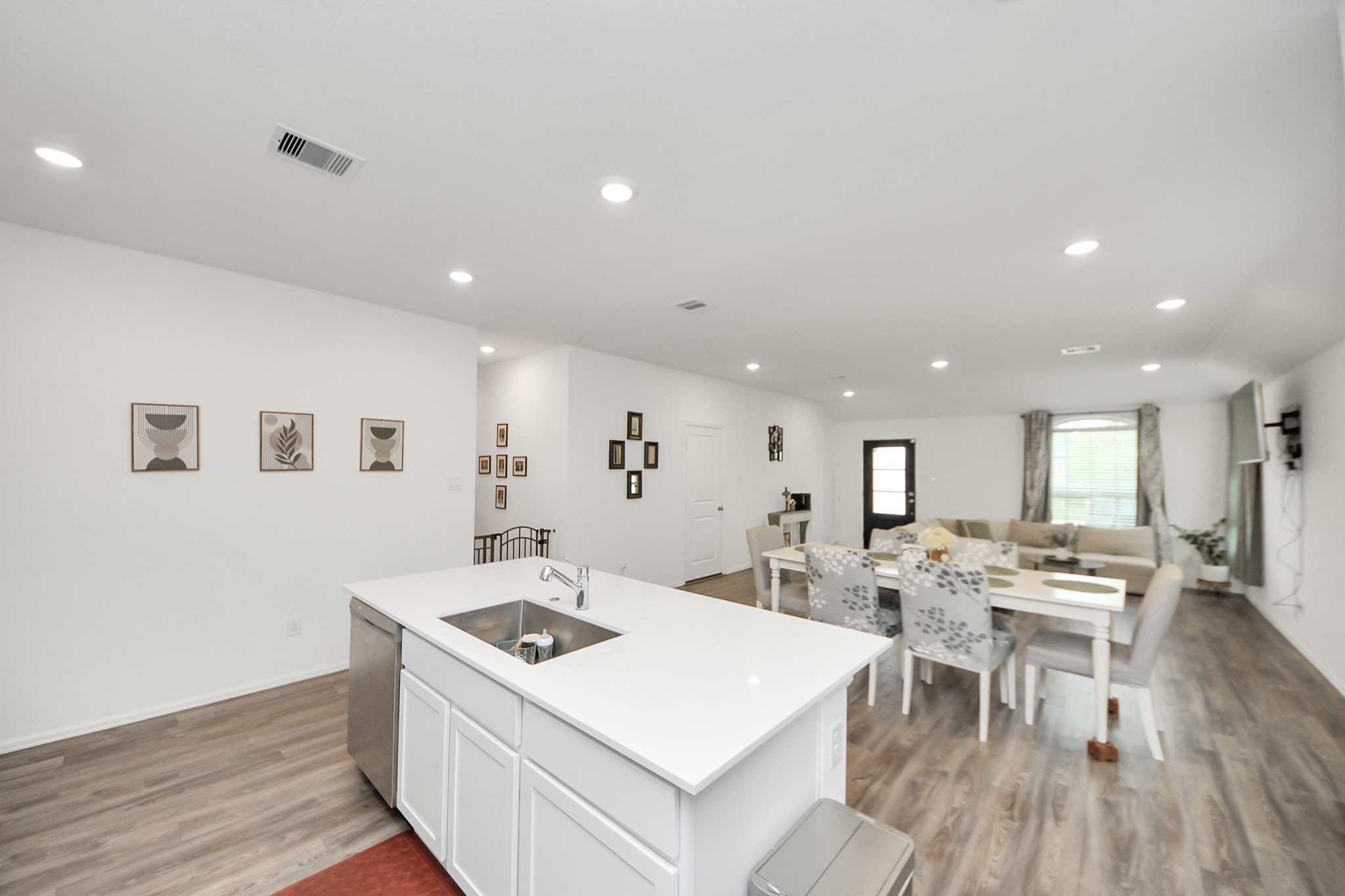 5418 Rabbit Crk Lane Richmond, TX 77469 - Photo 12 of 36 a large white kitchen with sink stove and refrigerator