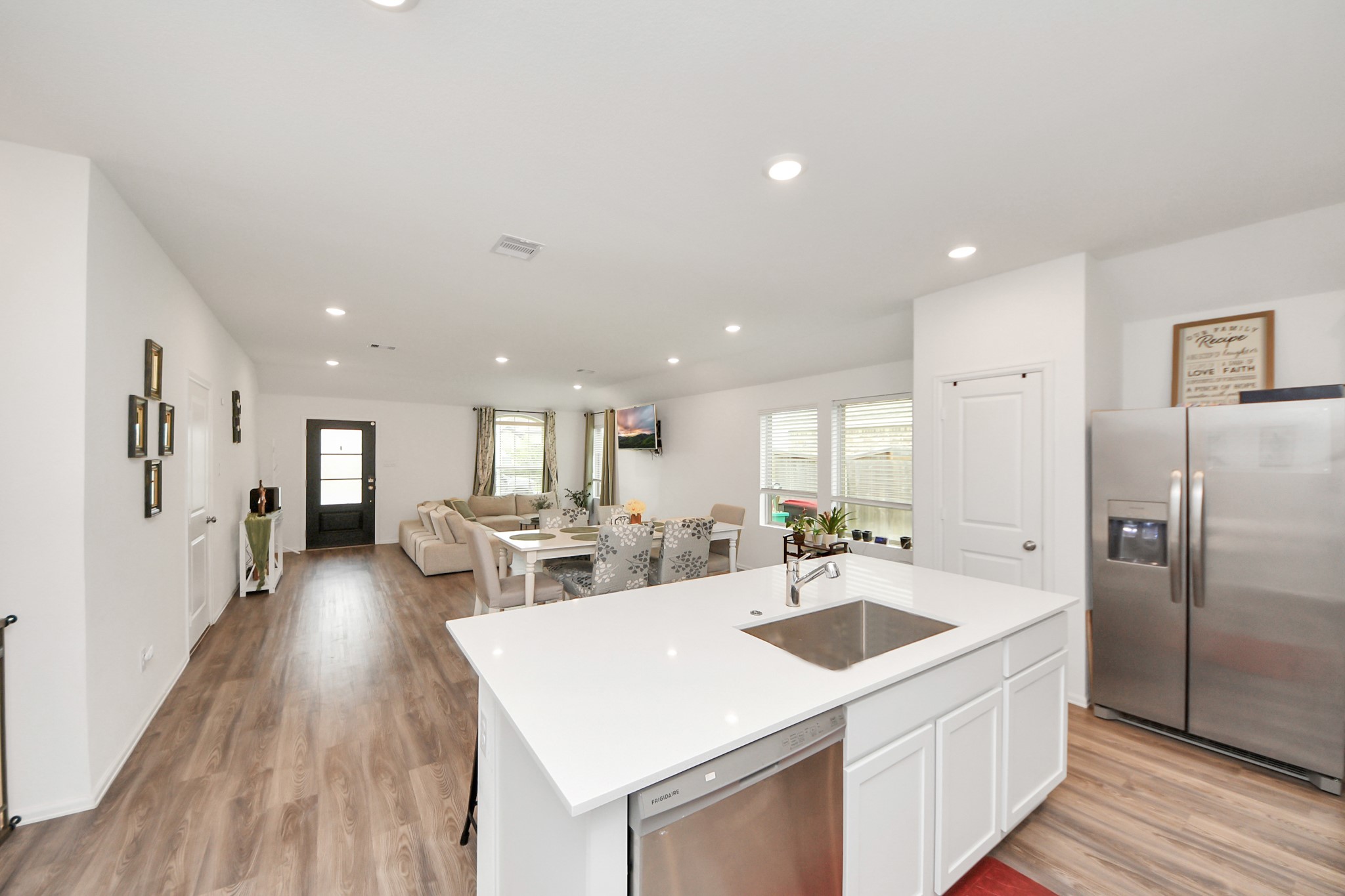 5418 Rabbit Crk Lane Richmond, TX 77469 - Photo 15 of 36 a kitchen with a sink a counter top stainless steel appliances and cabinets
