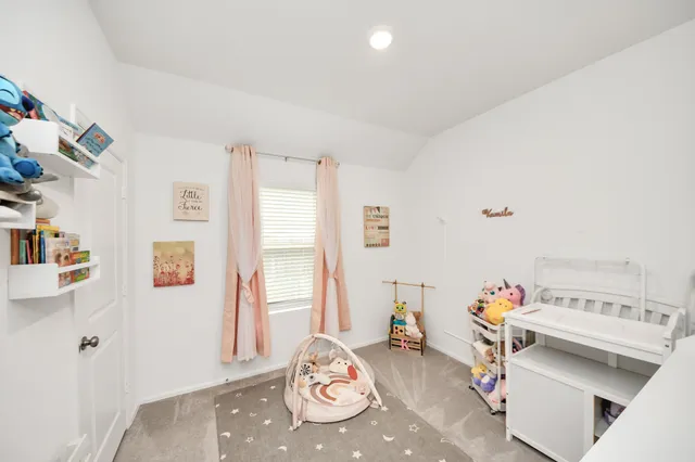 a bedroom with furniture and a wooden floor