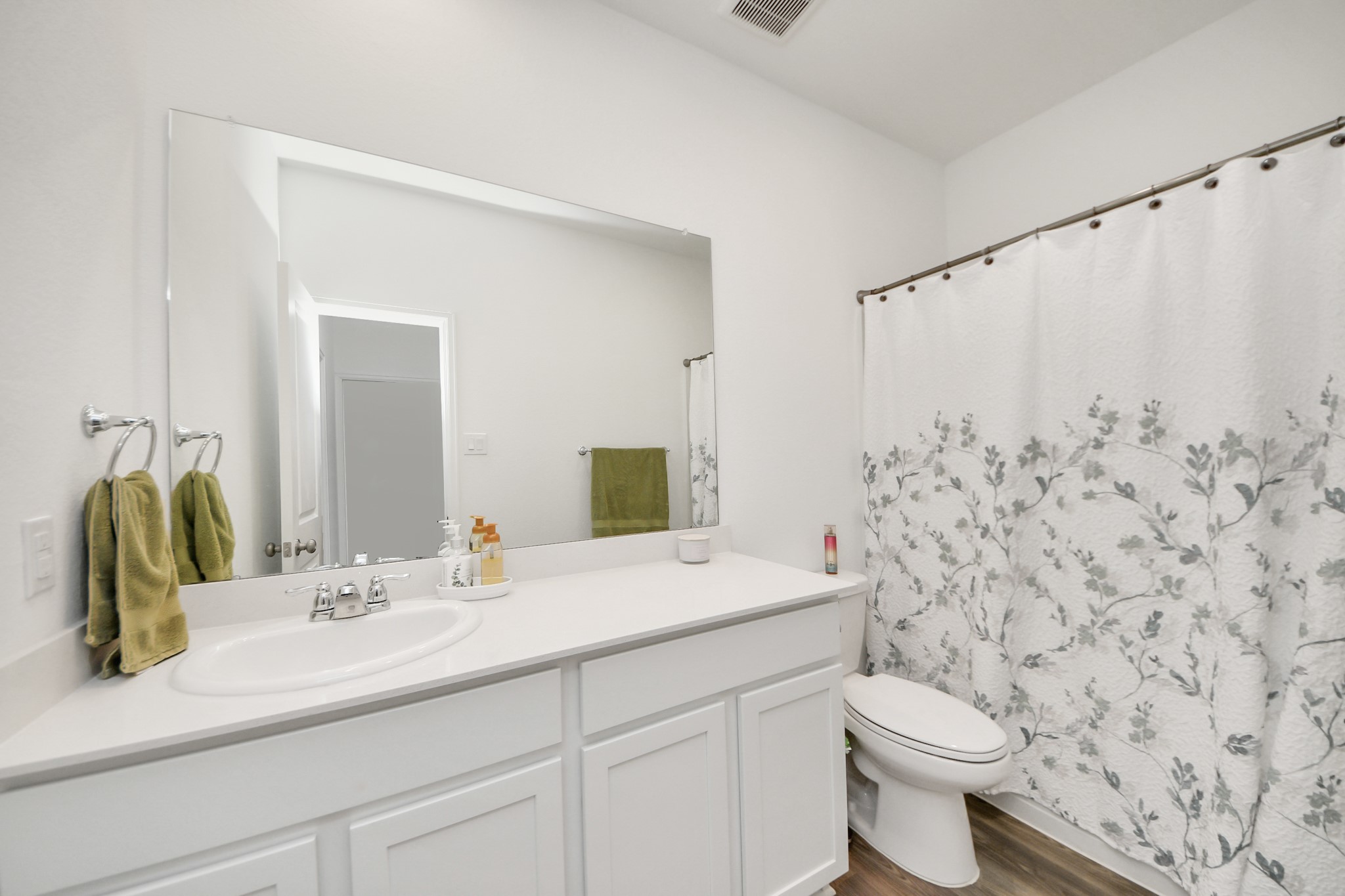 5418 Rabbit Crk Lane Richmond, TX 77469 - Photo 27 of 36 a bathroom with a granite countertop sink mirror vanity and toilet