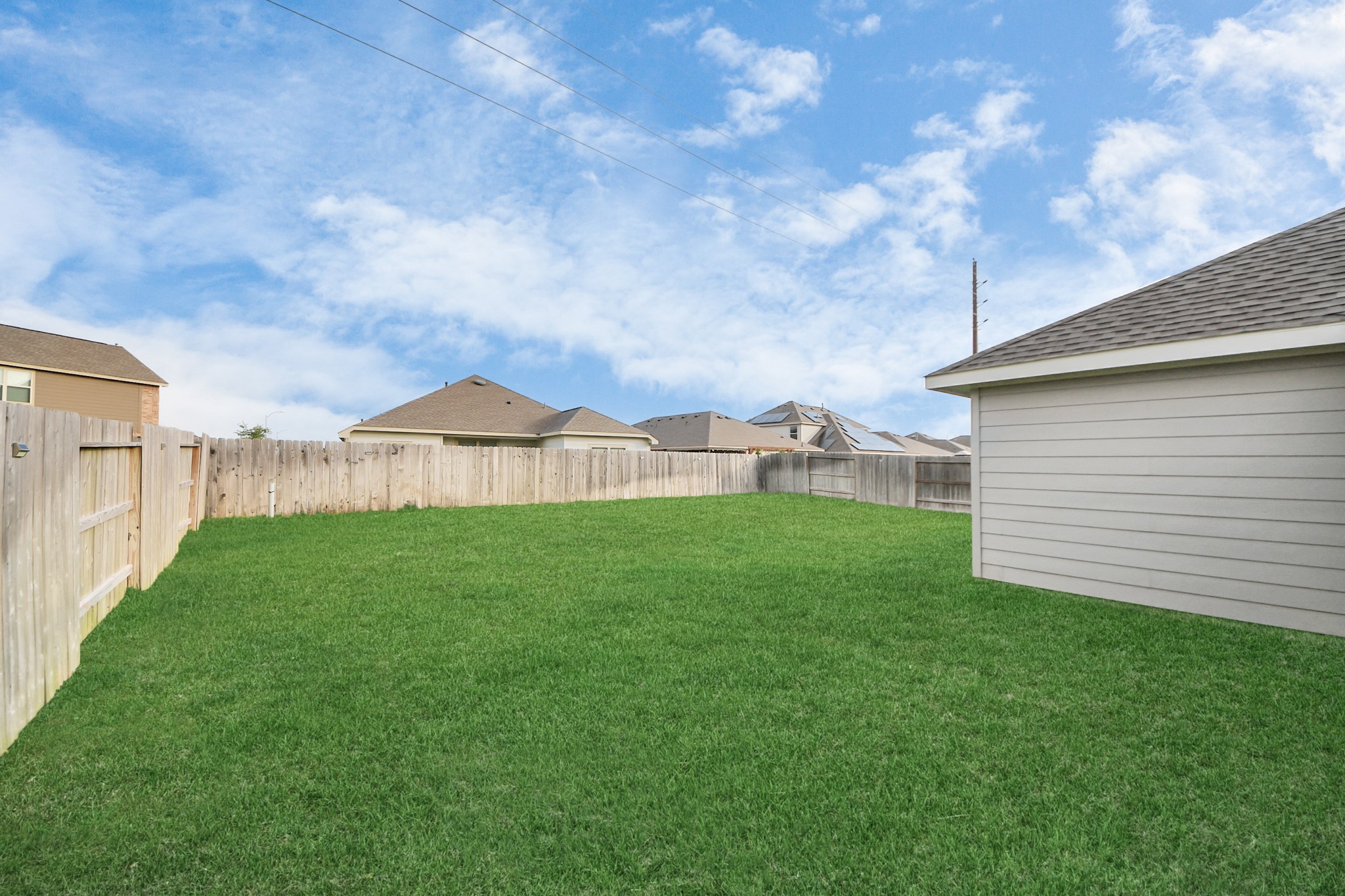 5418 Rabbit Crk Lane Richmond, TX 77469 - Photo 33 of 36 a view of a backyard with table and chairs plants and large tree