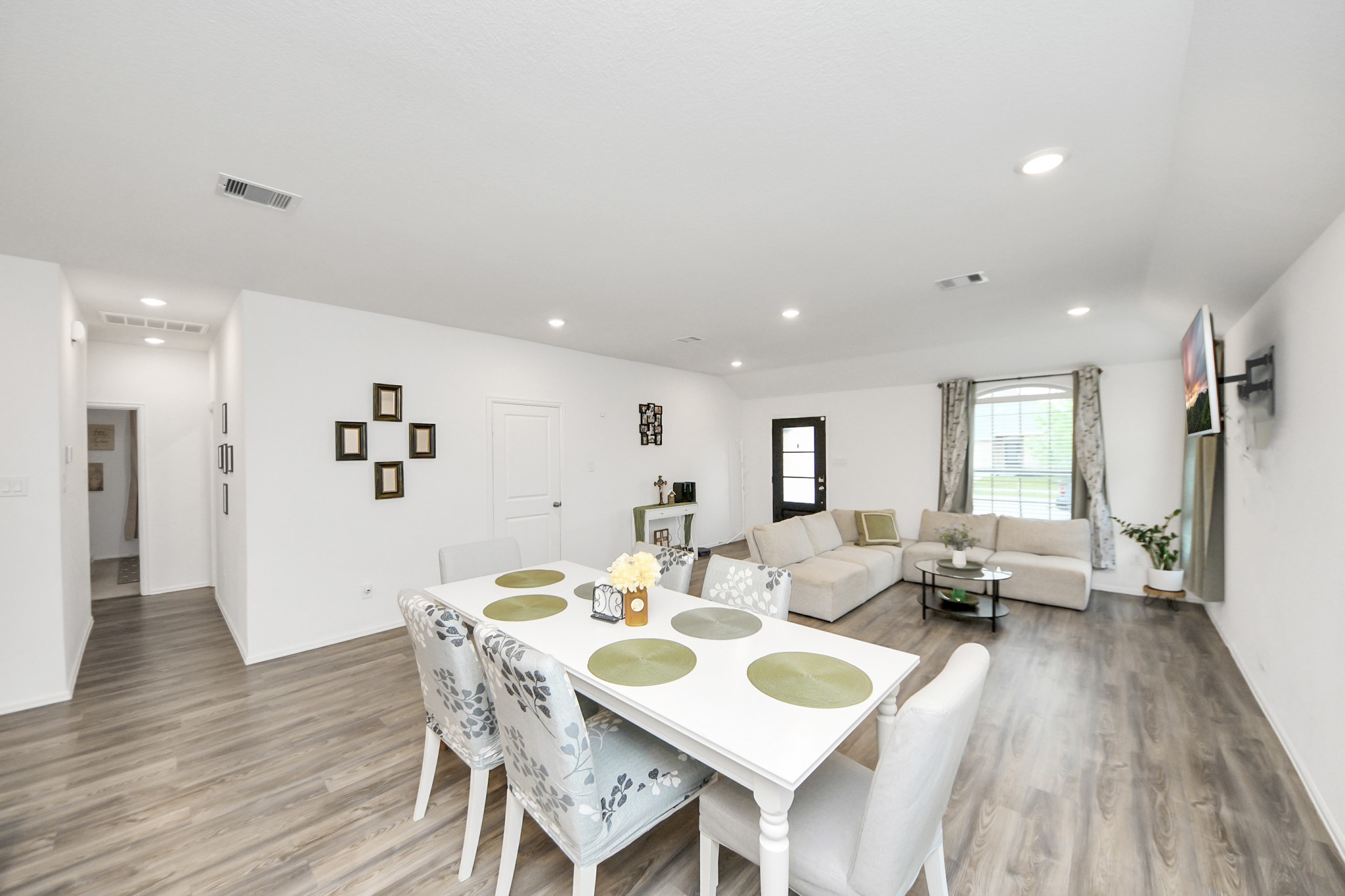 5418 Rabbit Crk Lane Richmond, TX 77469 - Photo 9 of 36 a view of a dining room with furniture and wooden floor
