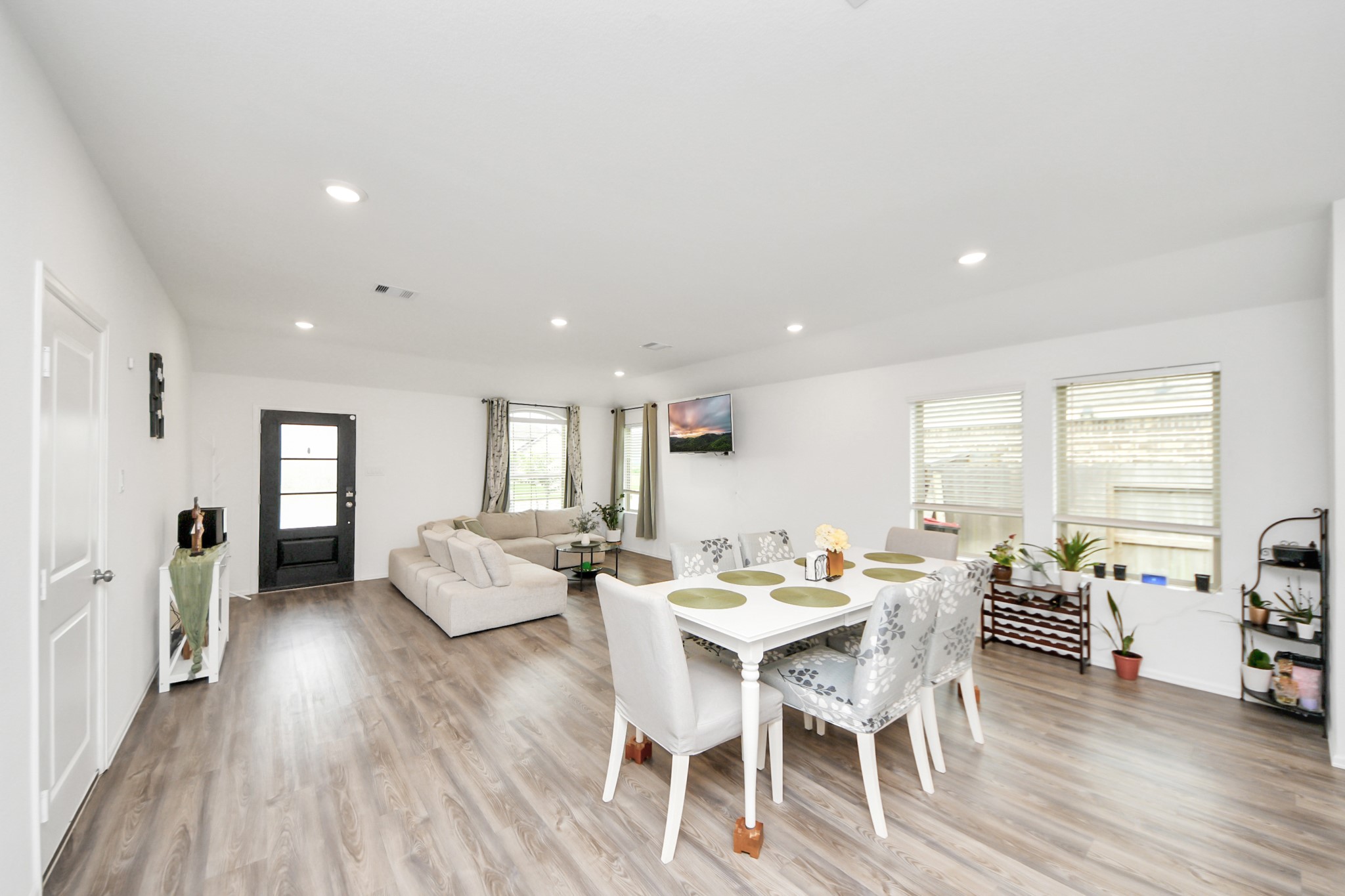 5418 Rabbit Crk Lane Richmond, TX 77469 - Photo 10 of 36 a view of a dining room with furniture and wooden floor