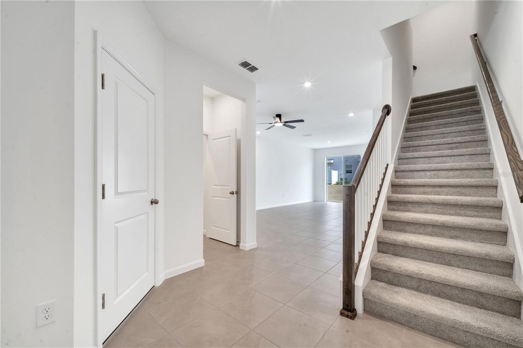 9068 Ocean Tide Way Kissimmee, FL 34747 - Photo 17 of 42 a view of an entryway with stairs