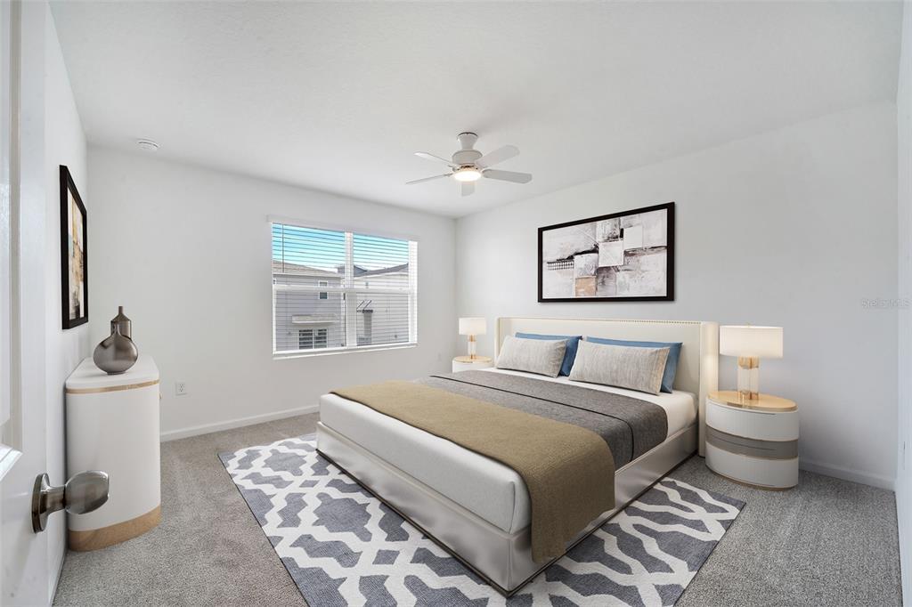 9068 Ocean Tide Way Kissimmee, FL 34747 - Photo 20 of 42 a bedroom with a bed and a couch