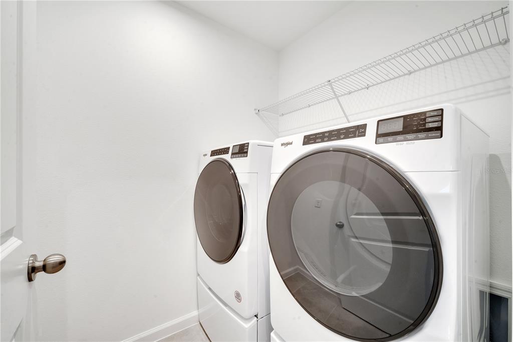 9068 Ocean Tide Way Kissimmee, FL 34747 - Photo 26 of 42 a utility room with dryer and washer