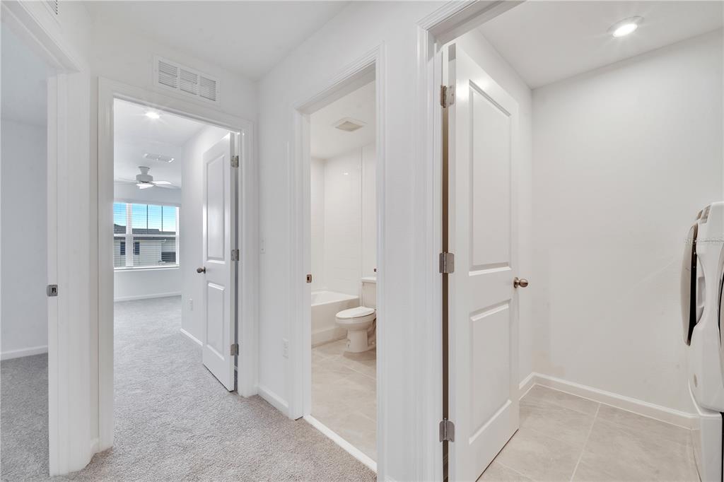 9068 Ocean Tide Way Kissimmee, FL 34747 - Photo 27 of 42 a view of a bathroom with a shower and a sink