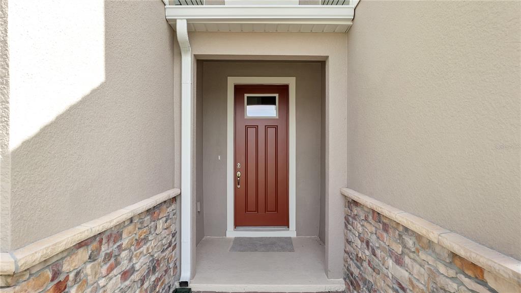 9068 Ocean Tide Way Kissimmee, FL 34747 - Photo 3 of 42 a view of an entryway with a fireplace