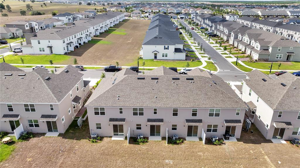 9068 Ocean Tide Way Kissimmee, FL 34747 - Photo 37 of 42 a picture of a city with tall buildings
