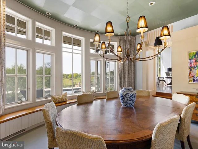 a large kitchen with kitchen island a large island in it