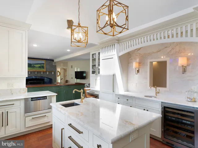a bathroom with a granite countertop sink a toilet and shower