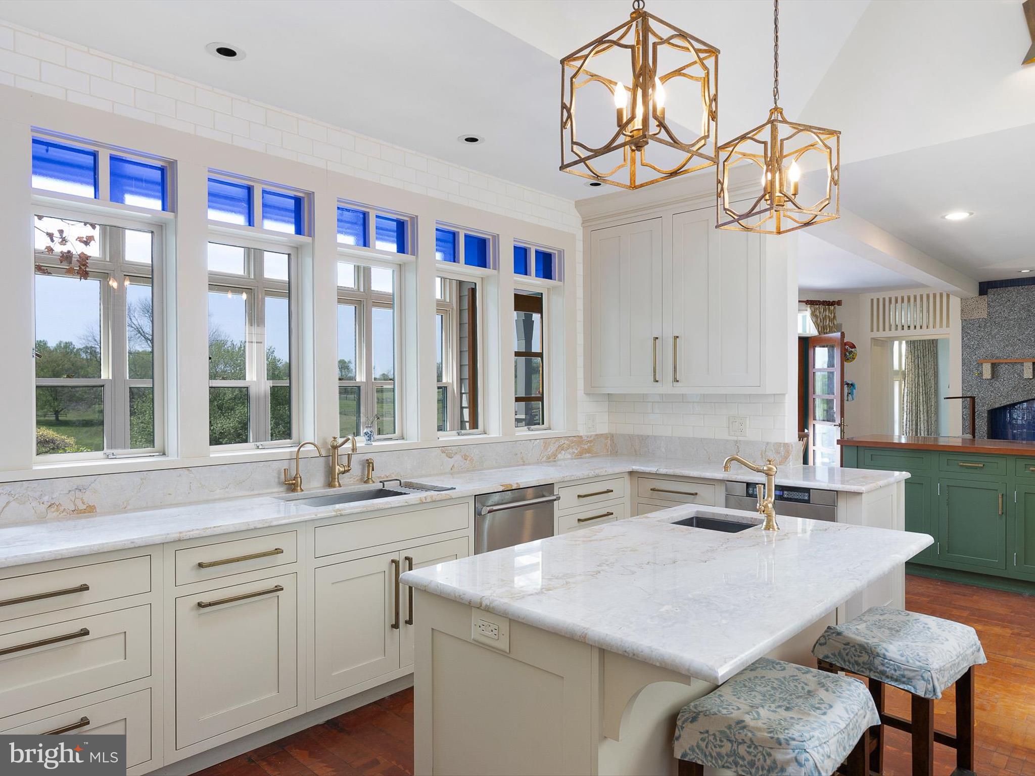2299 Hilltop View Road Coatesville, PA 19320 - Photo 25 of 96 a kitchen with a sink a island and chairs