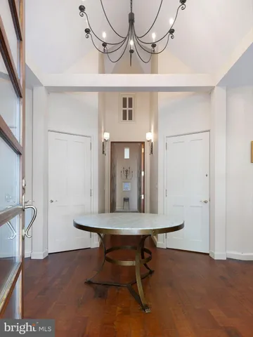 a large bed sitting in a bedroom next to a window