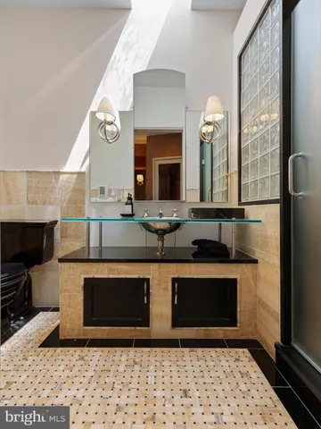 a view of a pathway both side of grassy field with shrub