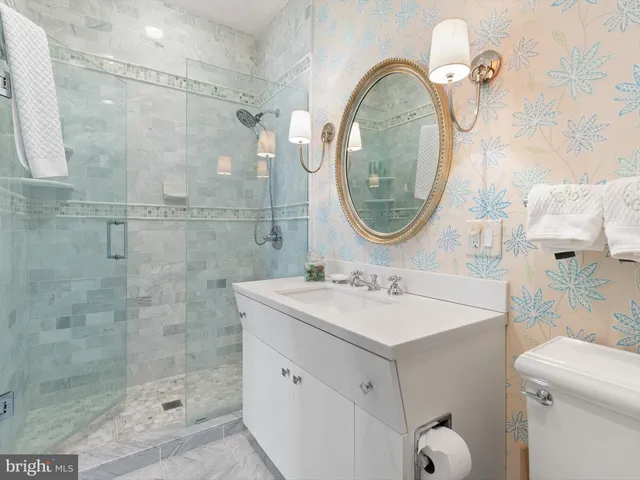 a view of a storage & utility room with two washing machine