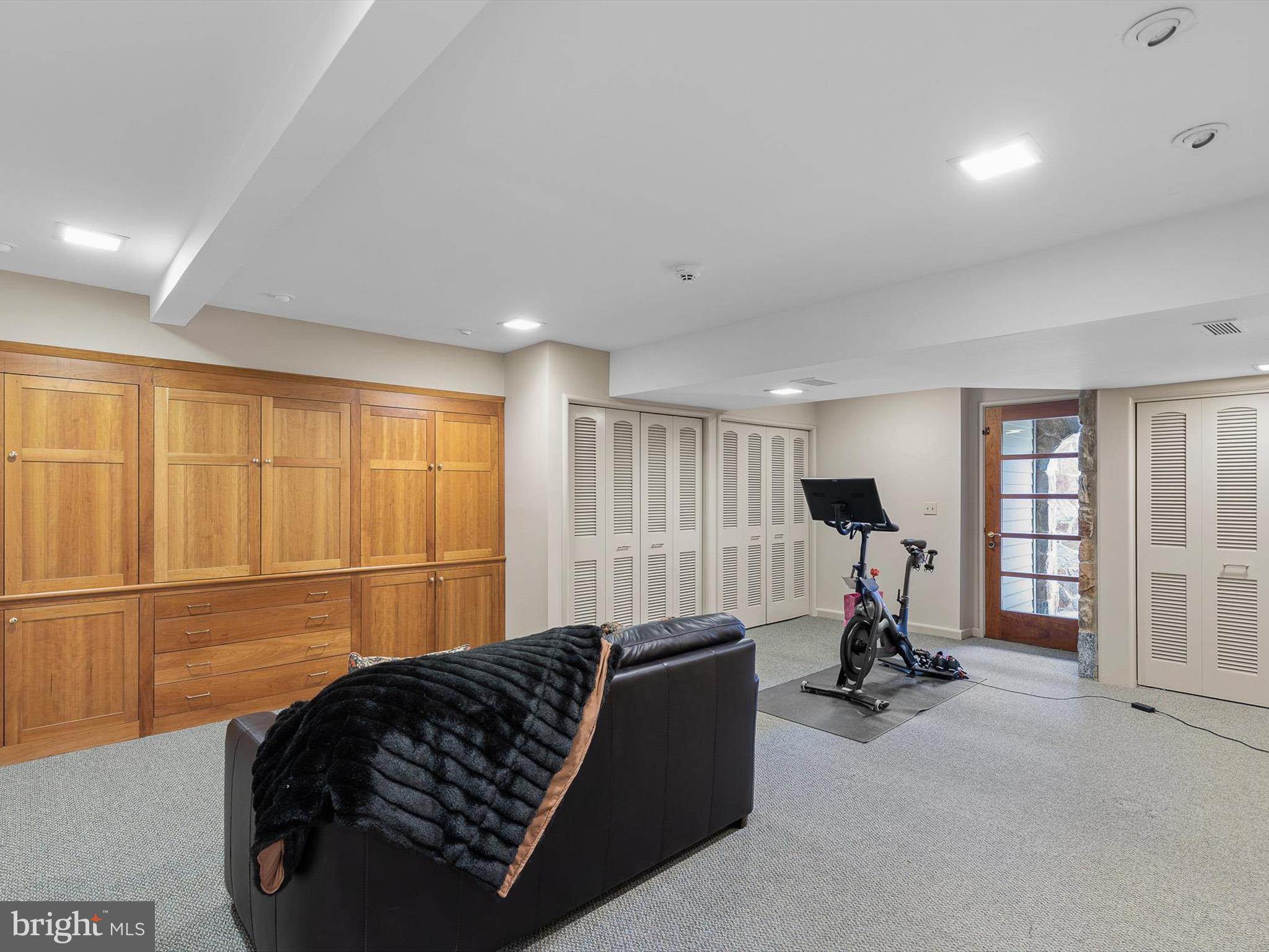 2299 Hilltop View Road Coatesville, PA 19320 - Photo 62 of 96 a living room with furniture gym equipment and a large window