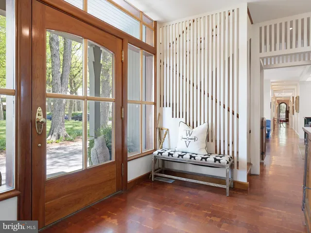 a living room with furniture a window and a fireplace