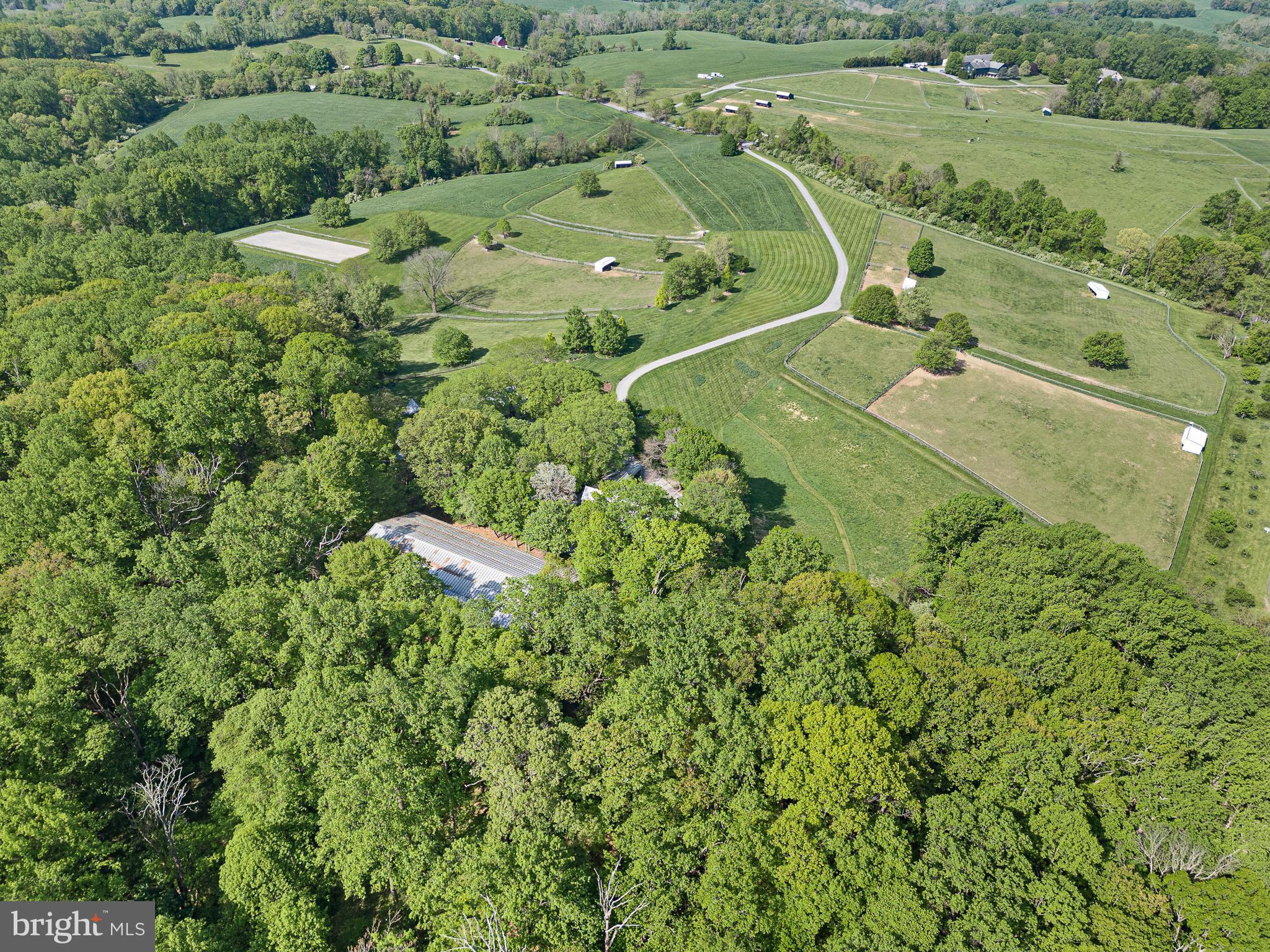 2299 Hilltop View Road Coatesville, PA 19320 - Photo 87 of 96 an aerial view of a house with a yard and large trees
