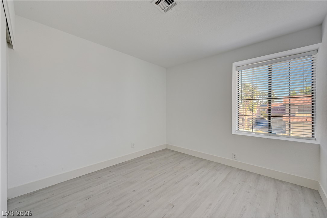 6505 Deadwood Road Las Vegas, NV 89108 - Photo 21 of 33 An airy bedroom with resilient laminate flooring awaits personalization.