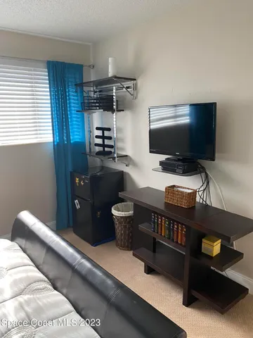 a room with furniture and flat screen tv