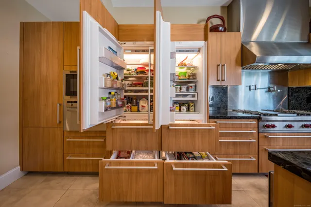 a kitchen with stainless steel appliances a stove and a refrigerator