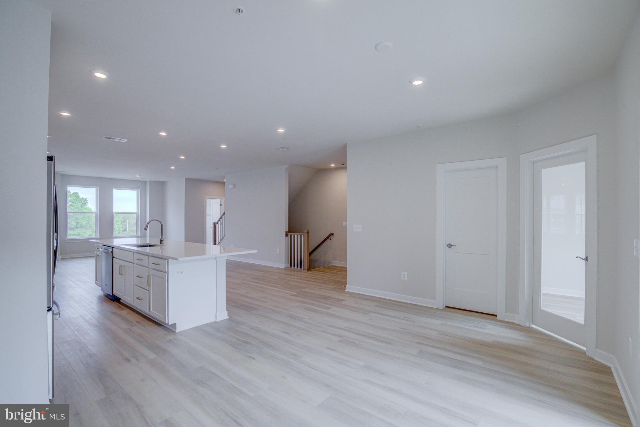 14138 Gypsum Loop Chantilly, VA 20151 - Photo 8 of 36 Luxury Vinyl Flooring throughout the Main Level