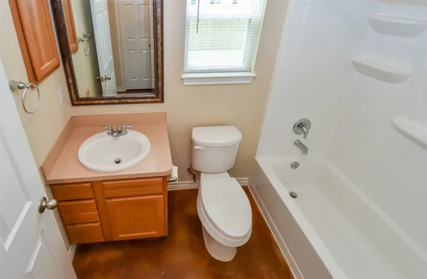 a bathroom with a sink toilet and a bathtub