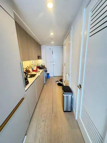 a kitchen with a sink and refrigerator